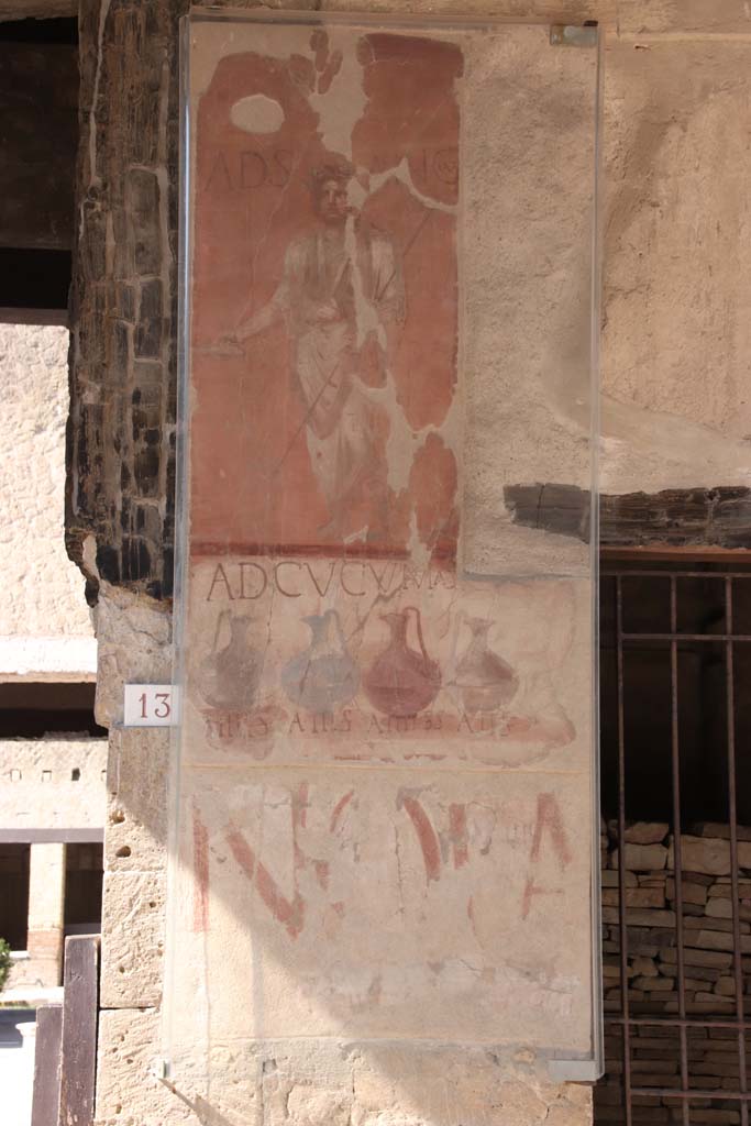 VI.13/14 Herculaneum, September 2021.
Painted sign on pilaster between entrances 13, on left, and 14. Photo courtesy of Klaus Heese.